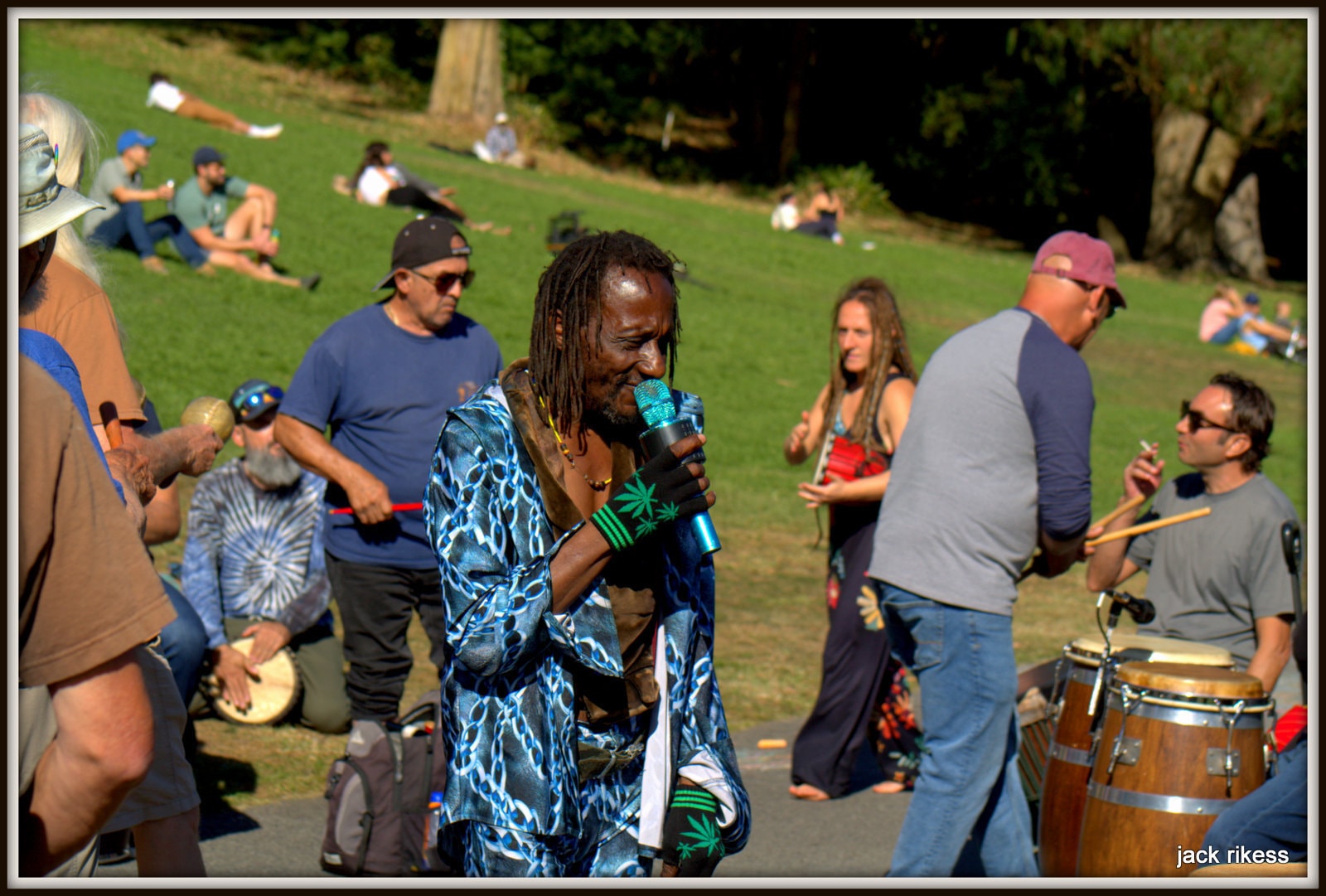 Drum Circle — dreadlocked singer with microphone