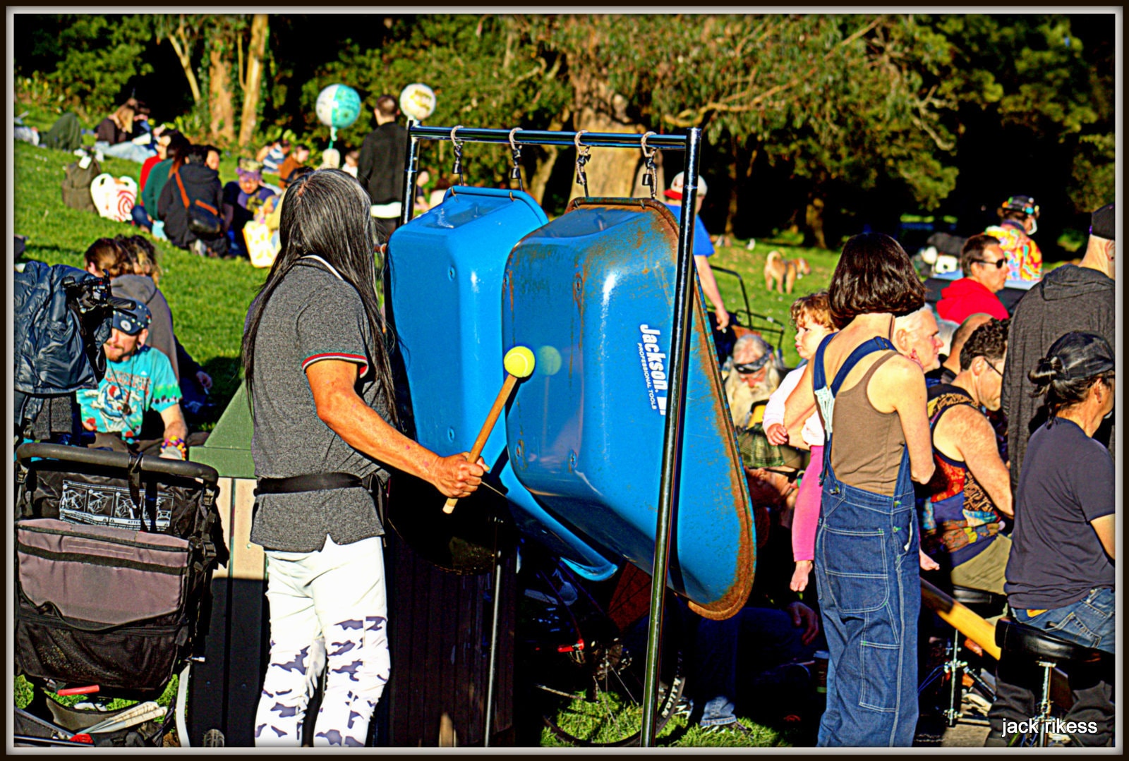 Drum Circle — laughing dancer in bucket hat
