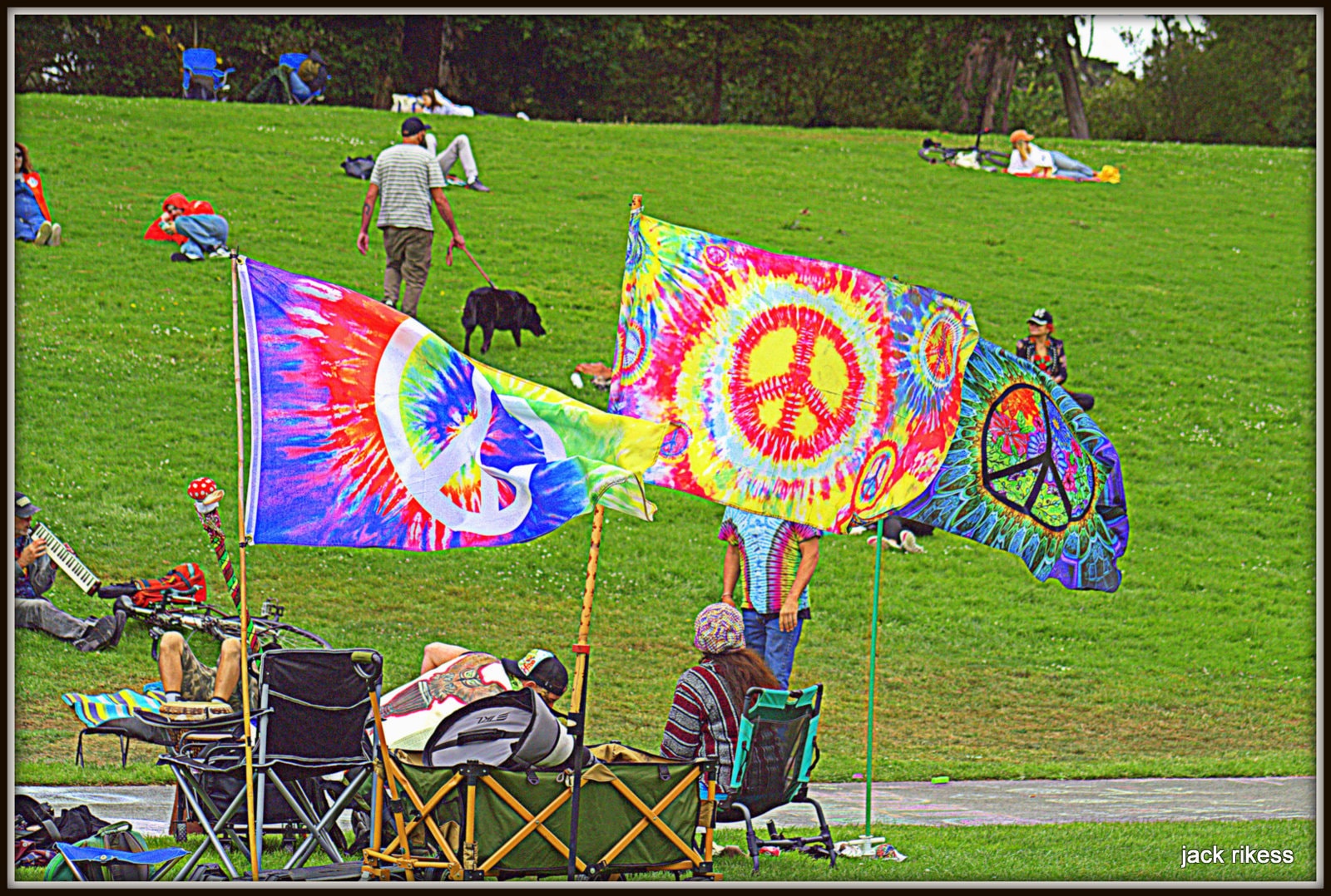 Drum Circle — tie-dye peace flags on the hillside