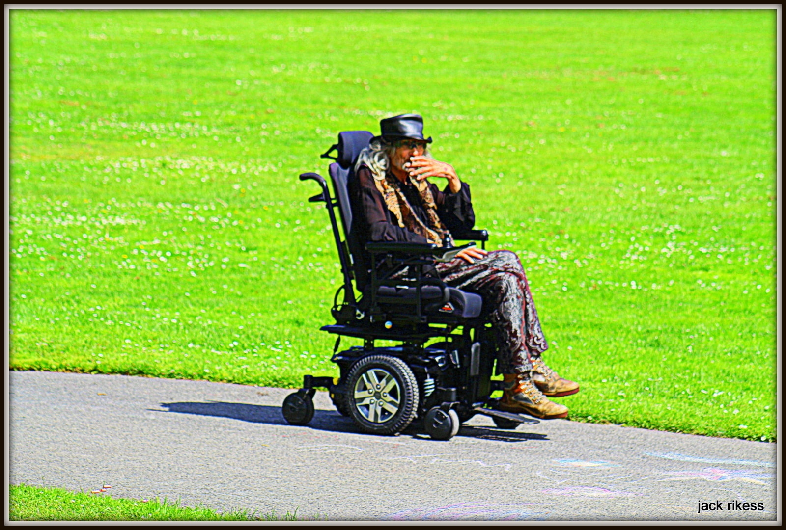 Drum Circle — figure in wheelchair on park path
